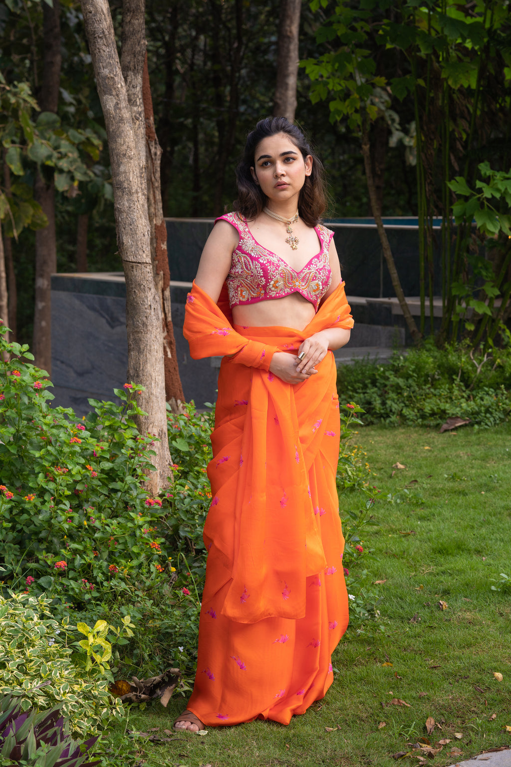 Vaishnavi saree – hand-embroidered orange silk organza drape paired with a contrast pink blouse, inspired by the hues of nature