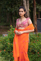 Vaishnavi saree – hand-embroidered orange silk organza drape paired with a contrast pink blouse, inspired by the hues of nature