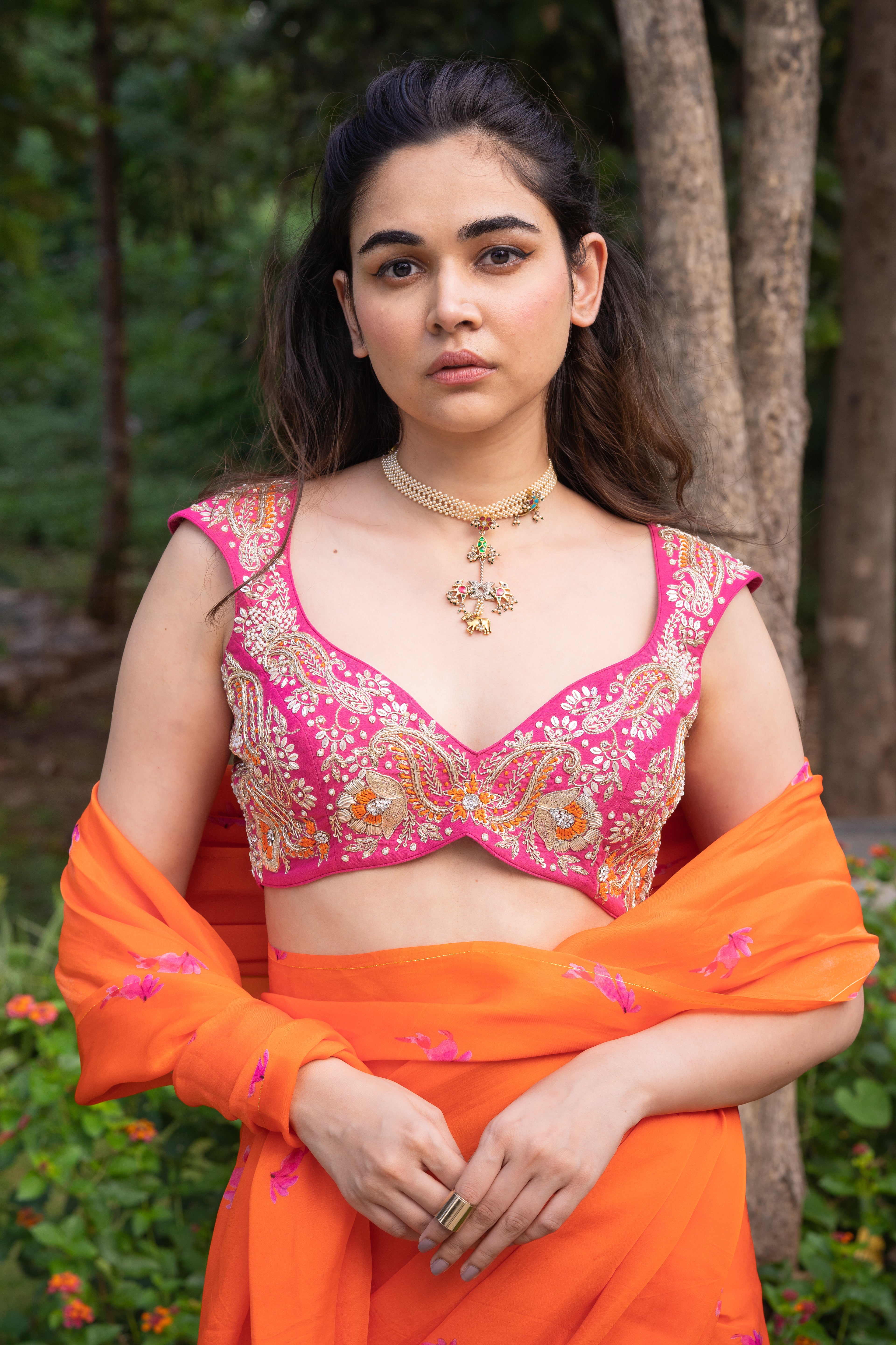Vaishnavi saree – hand-embroidered orange silk organza drape paired with a contrast pink blouse, inspired by the hues of nature