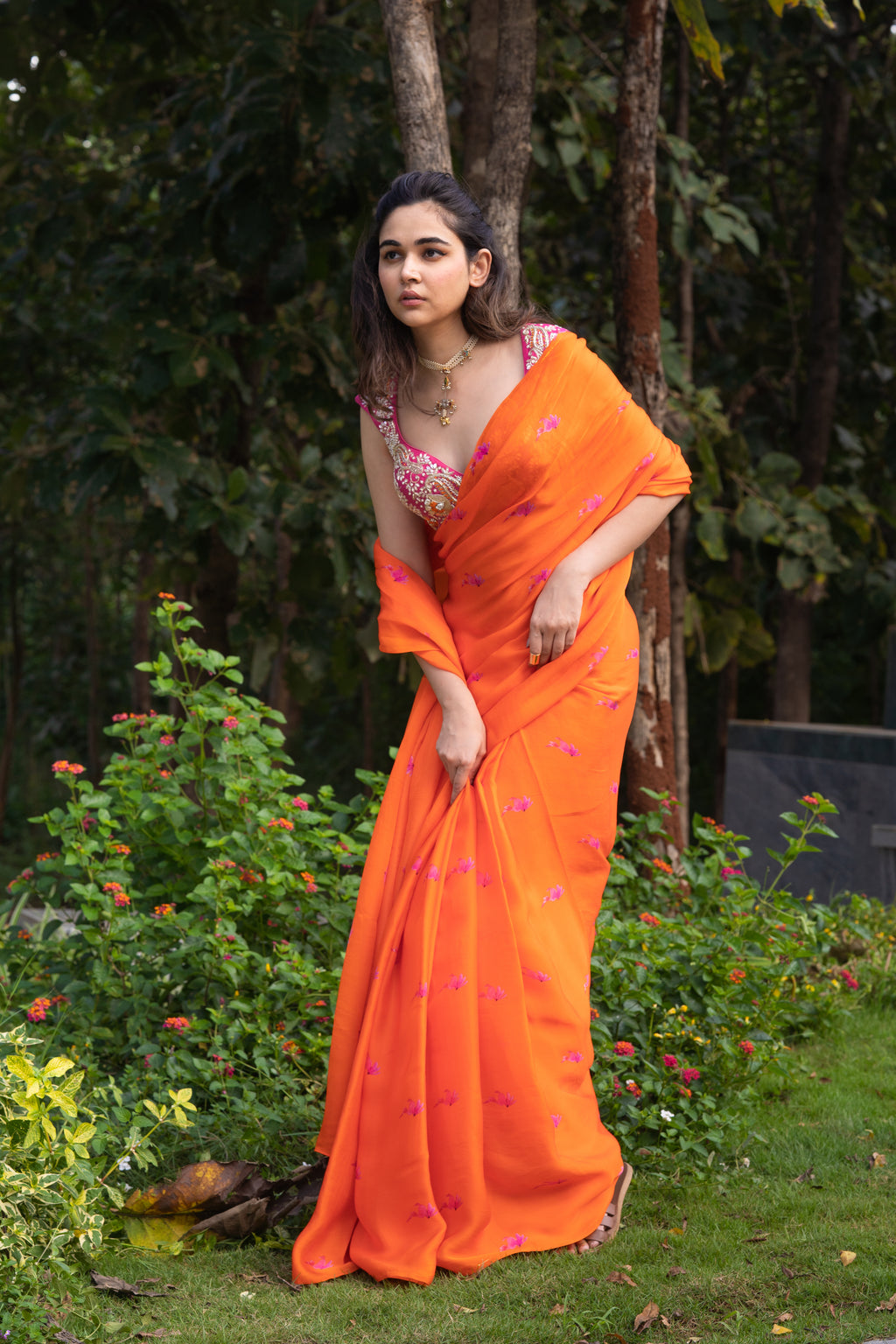 Vaishnavi saree – hand-embroidered orange silk organza drape paired with a contrast pink blouse, inspired by the hues of nature